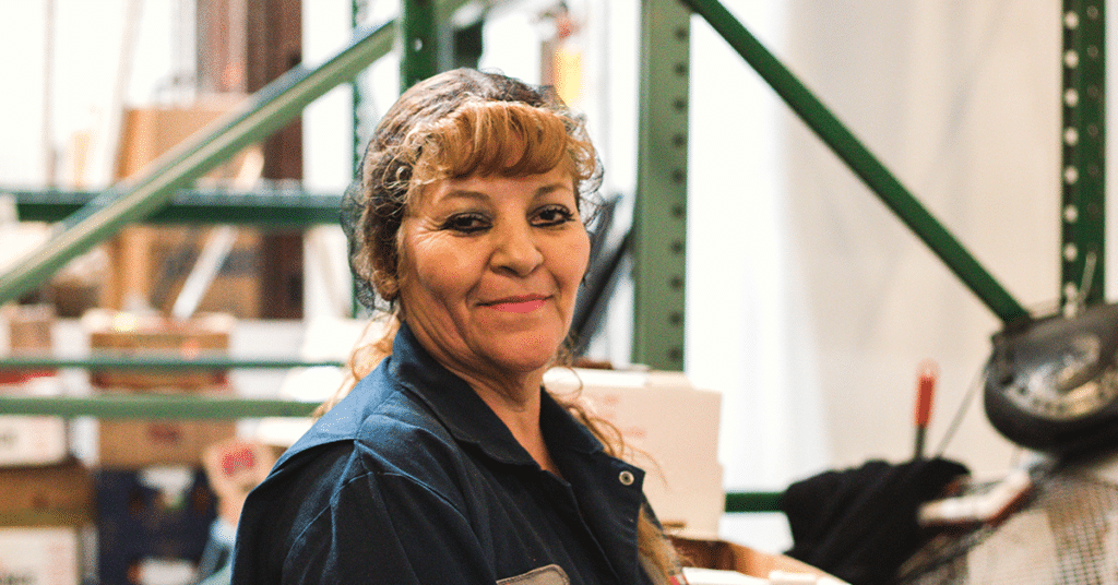 Woman in hairnet smiling, careers