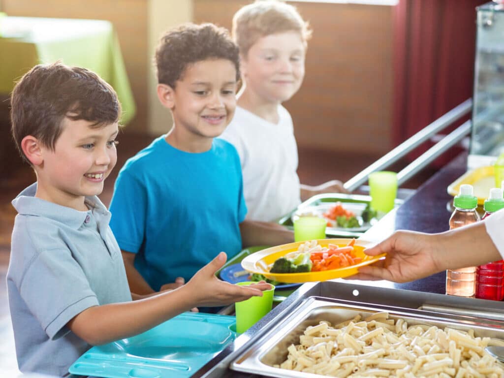 Kids getting healthy school meals in the cafeteria